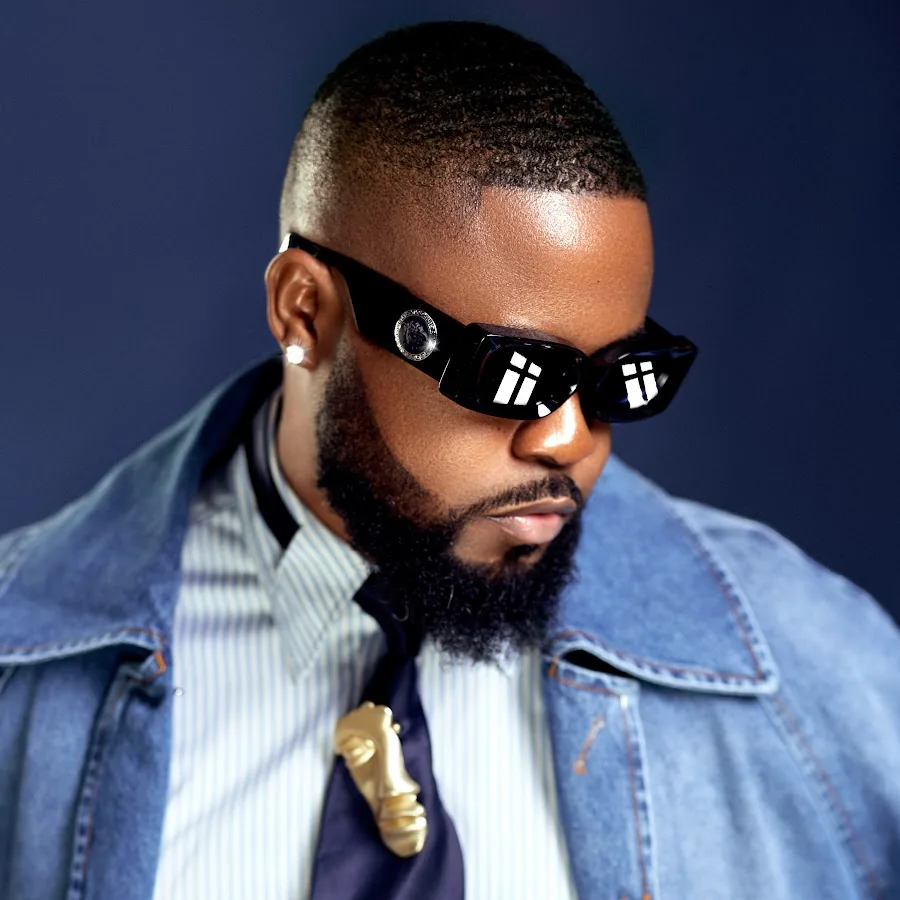 Roody Roodboy — editorial portrait with Versace shades